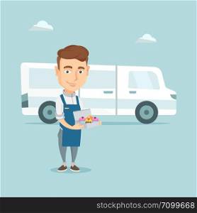Friendly delivery man holding a box of cakes. Caucasian baker delivering cakes. Young man with cupcakes standing on the background of delivery truck. Vector flat design illustration. Square layout.. Baker delivering cakes vector illustration.