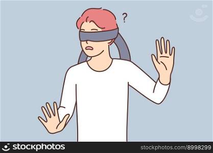Frightened casual teen boy blindfolded trying to grope road of action in blind. Frightened schoolboy is confused while playing hide-and-seek or entertaining quest. Frightened teen boy blindfolded trying to grope road of action in blind