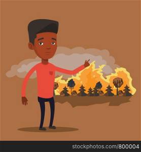 Frustrated man standing on the background of forest fire. An african-american man pointing at forest in fire. Concept of environmental destruction. Vector flat design illustration. Square layout.. Man standing on background of wildfire.