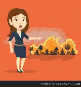 Frustrated woman standing on the background of a big forest fire. Caucasian woman pointing at forest in fire. Concept of environmental destruction. Vector flat design illustration. Square layout.. Woman standing on background of wildfire.