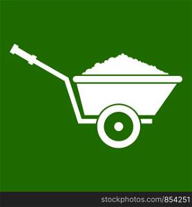 Garden wheelbarrow icon white isolated on green background. Vector illustration. Garden wheelbarrow icon green