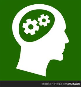 Gear in head icon white isolated on green background. Vector illustration. Gear in head icon green