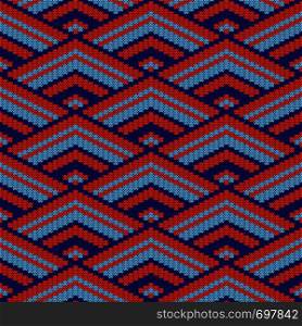 Geometrical ornate seamless knitted vector pattern as a fabric texture in blue and orange colors