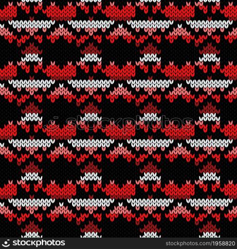 Geometrical ornate seamless knitted vector pattern as a fabric texture in red, pink, black and white colors