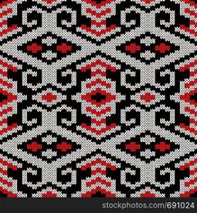 Geometrical ornate seamless knitted vector pattern as a fabric texture in red, black and white colors