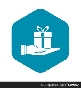 Gift box in hand icon. Simple illustration of gift box in hand vector icon for web design. Gift box in hand icon, simple style