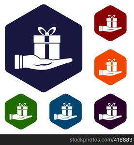 Gift box in hand icons set rhombus in different colors isolated on white background. Gift box in hand icons set