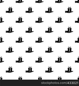 Gift box in hand pattern seamless in simple style vector illustration. Gift box in hand pattern vector
