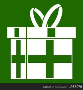 Gift in a box icon white isolated on green background. Vector illustration. Gift in a box icon green