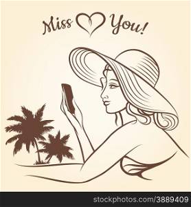 Girl on a beach using mobile phone for text messaging Miss You.