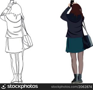 girl who raises her cell phone to photograph. Woman raises her cell phone to photograph -
