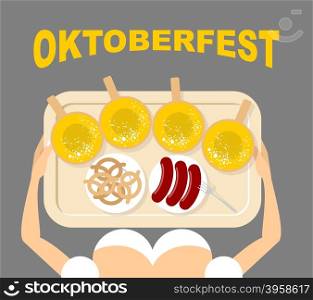 Girl with a tray with beer and sausages. Pretzels in Bowl. View from top. Oktoberfest. Traditional national food for Festival of beer.
