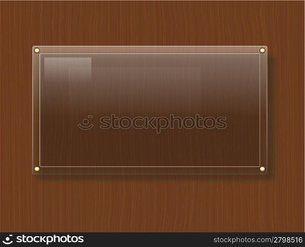 Glass plate on wood background