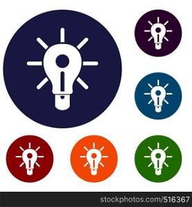 Glowing light bulb icons set in flat circle red, blue and green color for web. Glowing light bulb icons set