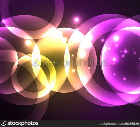 Glowing shiny overlapping circles composition on dark background. Glowing shiny overlapping circles composition on dark background, purple and yellow colors magic style light effects abstract design template