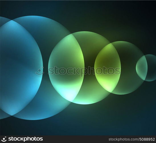 Glowing shiny overlapping circles composition on dark background. Glowing blue shiny overlapping circles composition on dark background, magic style light effects abstract design template