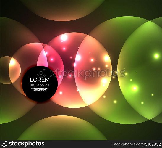 Glowing shiny overlapping circles composition on dark background. Glowing red and green color shiny overlapping circles composition on dark background, magic style light effects abstract design template