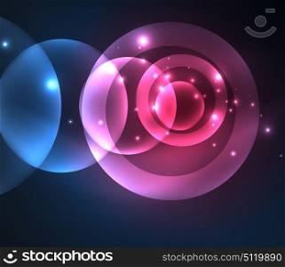 Glowing shiny overlapping circles composition on dark background. Glowing blue and purple colors shiny overlapping circles composition on dark background, magic style light effects abstract design template