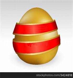 Gold easter egg tied with red ribbon