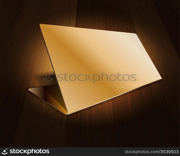 Gold name plate on wooden background