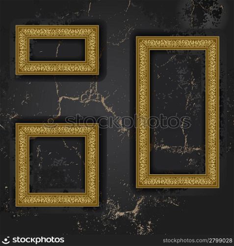 Gold three frames on the black wall