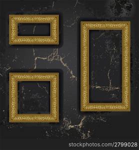 Gold three frames on the black wall