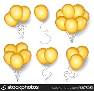 Golden ballons with rope cords. Golden ballons with rope cords isolated on white background for new year party or festive anniversary celebration. Gold or yellow balloon set