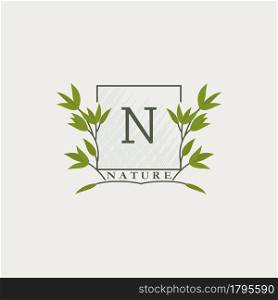 Green eco letters N logo with leaves in square shape. Initials with botanical elements with floral letter design for business identity
