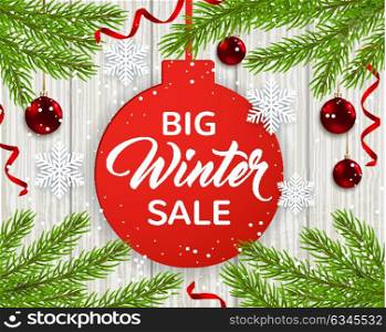 Green fir branches, white snowflakes and red balls on a wooden background. Design for seasonal winter Christmas sale.