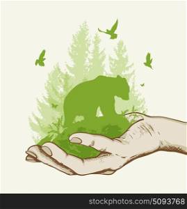Green fir tree, bear and birds in the hand. Ecology concept.