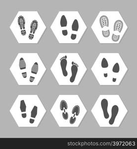 Grey footprints icons - female, male and sport shoe. Vector illustration. Footprints icons - female, male