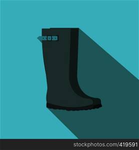 Grey rubber boots flat icon on a blue background. Grey rubber boots flat icon