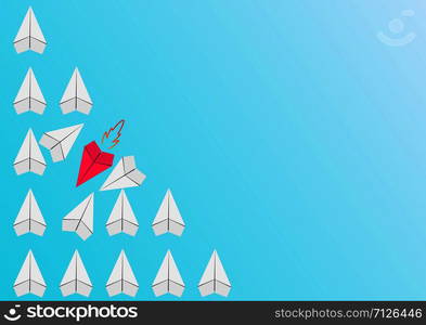 group of paper planes of the same color flies in one direction, one red plane flies across the group pushing everyone in its path. Conceptual plot on the topic of business or career growth.