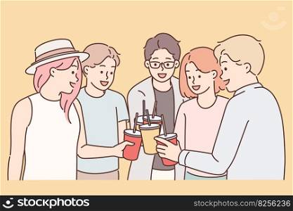 Group of young guys and girls drink drinks during holiday party from disposable cups with straw. Youth teenagers have good time together enjoying chatting with friends at holiday party. Group of young guys and girls drink drinks during holiday party from disposable cups with straw