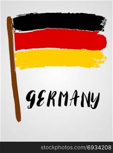 Grunge brush stroke with flag. Grunge brush stroke with Germany national flag isolated on light grey background