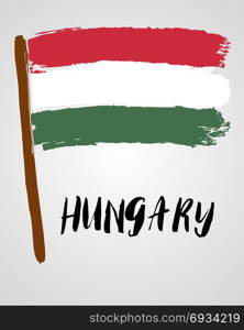 Grunge brush stroke with flag. Grunge brush stroke with Hungary national flag isolated on light grey background
