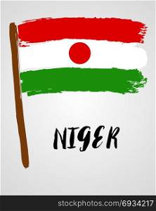Grunge brush stroke with flag. Grunge brush stroke with Niger national flag isolated on light grey background