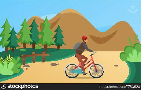 Guy in helmet and sportswear riding in forest. Man rides bicycle on sandy road. Male character doing sports outdoors. Sportsman cycling through trees. Person spends time on background of mountain. Man rides bicycle on sandy road in forest. Sportsman cycling on background of mountain landscape