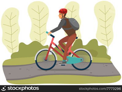 Guy in helmet and sportswear riding in forest. Man rides bicycle on sandy road. Male character doing sports outdoors. Sportsman cycling through trees. Person spends time on background of park. Man rides bicycle on sandy road in forest. Sportsman cycling on background of park landscape