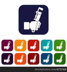Hacksaw in man hand icons set vector illustration in flat style In colors red, blue, green and other. Hacksaw in man hand icons set flat