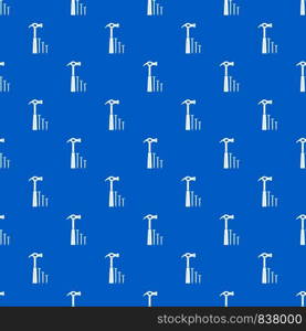 Hammer and nails pattern repeat seamless in blue color for any design. Vector geometric illustration. Hammer and nails pattern seamless blue