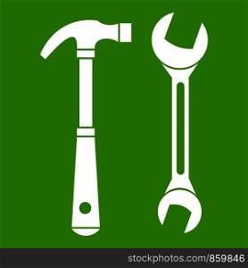 Hammer and wrench icon white isolated on green background. Vector illustration. Hammer and wrench icon green