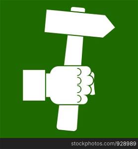 Hand hoding hammer with tool icon white isolated on green background. Vector illustration. Hand hoding hammer with tool icon green