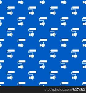 Hand hoding paint roller pattern repeat seamless in blue color for any design. Vector geometric illustration. Hand hoding paint roller pattern seamless blue