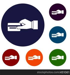 Hand holding a credit card icons set in flat circle reb, blue and green color for web. Hand holding a credit card icons set
