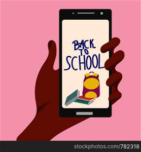 Hand holding a smartphone with books, backpack and lettering back to school.