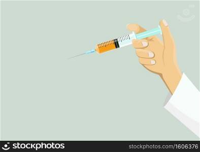 Hand holding a vaccine Orange liquid in the syringe. injecting It uses for prevention, immunization, and treatment from coronavirus infection   COVID-19,nCoV 2019   Medicine concept. with copy space. 