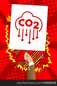 Hand holding banner with CO2 emission sign, Carbon dioxide icon on white paper. Man showing billboard.