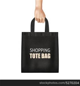 Hand Holding Black Shopping Bag Realistic. Hand holding fashionable black canvas shopping tote bag with lettering realistic close up view vector illustration