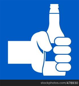 Hand holding bottle of beer icon white isolated on blue background vector illustration. Hand holding bottle of beer icon white